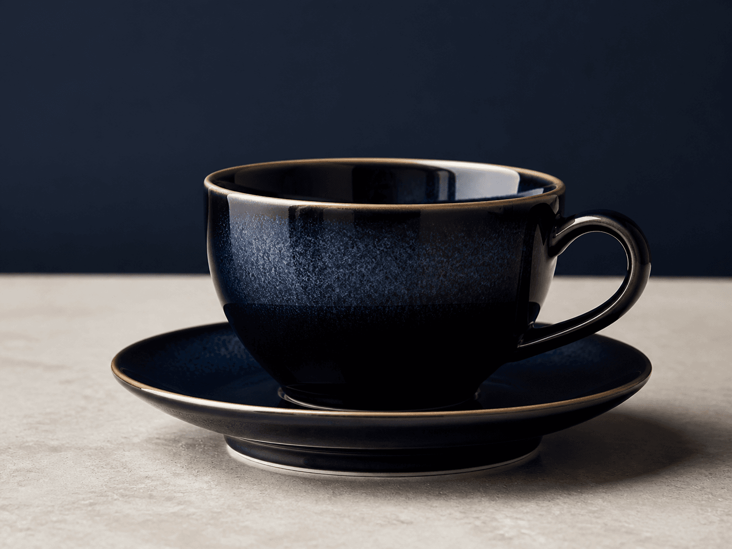 Directional close-up concept of a dark blue ZOLENTOCO ceramic cup and saucer